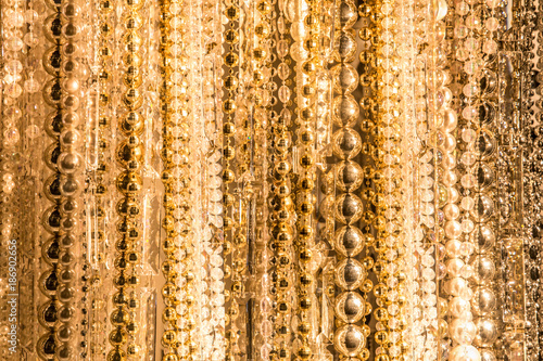 Texture from strings of various gold beads photo