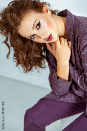 Portrait of luxurious vogue model, with vawy hairdo, fashion makeup. © khosrork