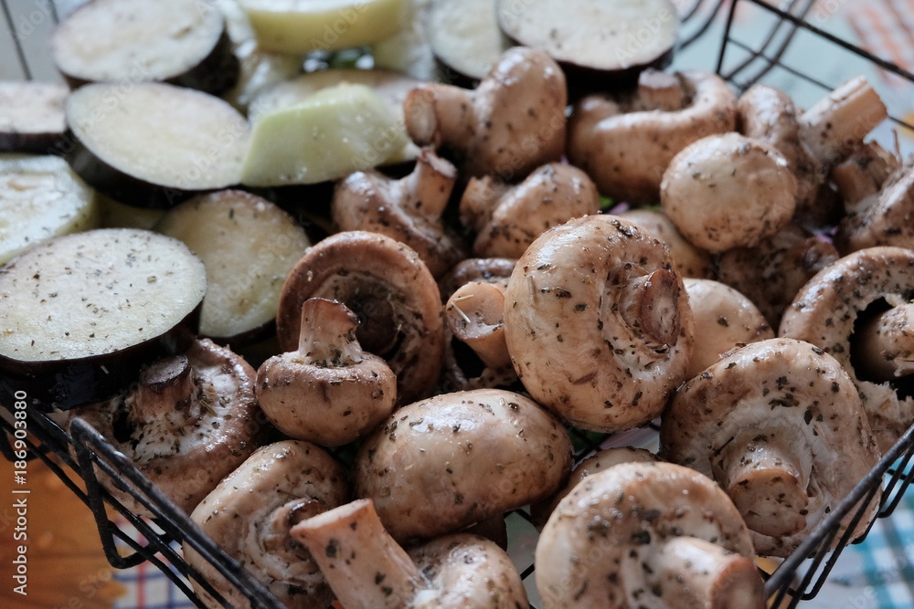 Fresh vegetables with seasoning ready to be grilled at outdoor party Fresh vegetables with seasoning ready to be grilled at outdoor party