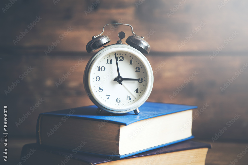 alarm clock on books alarm clock on books