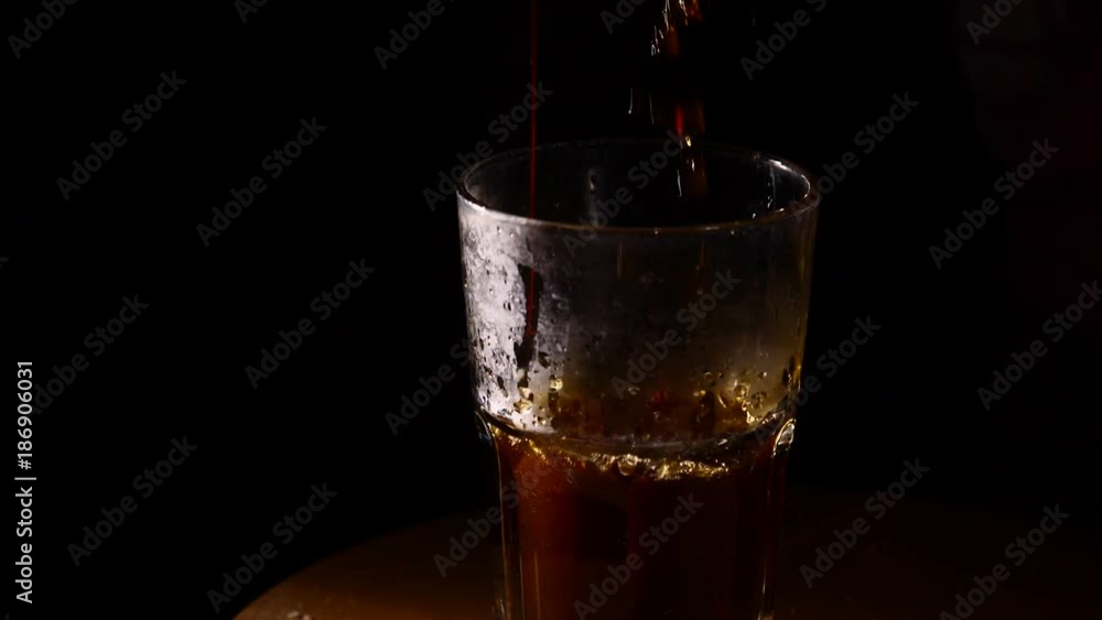 Cocktail pouring into glass slow motion Cocktail pouring into glass slow motion