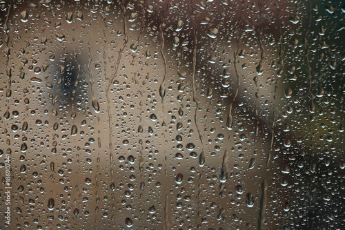 Raindrops on window glass , rainy day