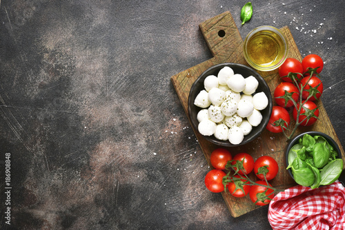 ngredients  for making traditional italian salad caprese .