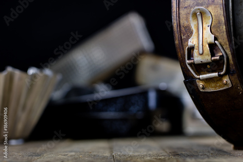 Tins and baking forms on a wooden table. Old kitchen accessories on the kitchen table.