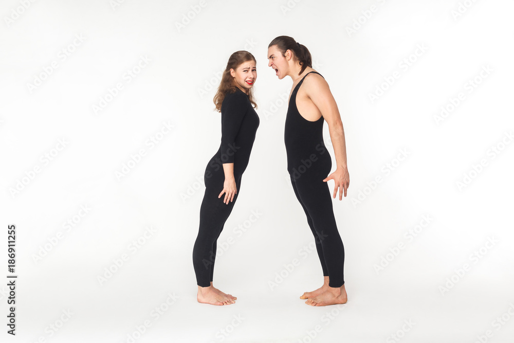 Quarrel in partnership. Angry man shout at young adult woman Quarrel in partnership. Angry man shout at young adult woman