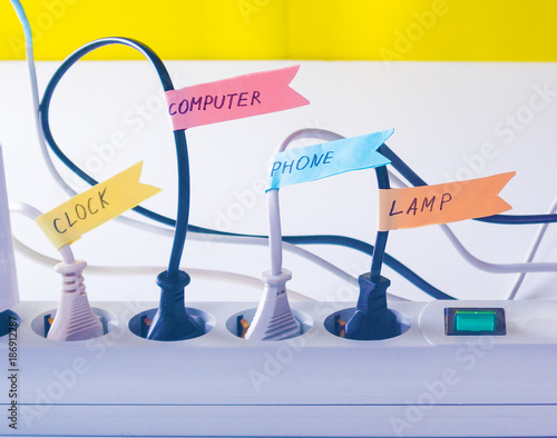 ?onvenient life hack with stickers on the wires inserted into the socket