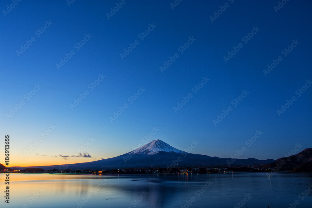 the mountain Fuji at dawn with peaceful lake reflection