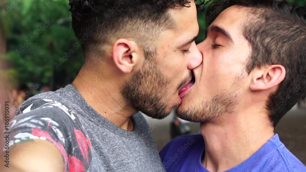 Homosexual couple talking a selfie and kissing Homosexual couple talking a selfie and kissing