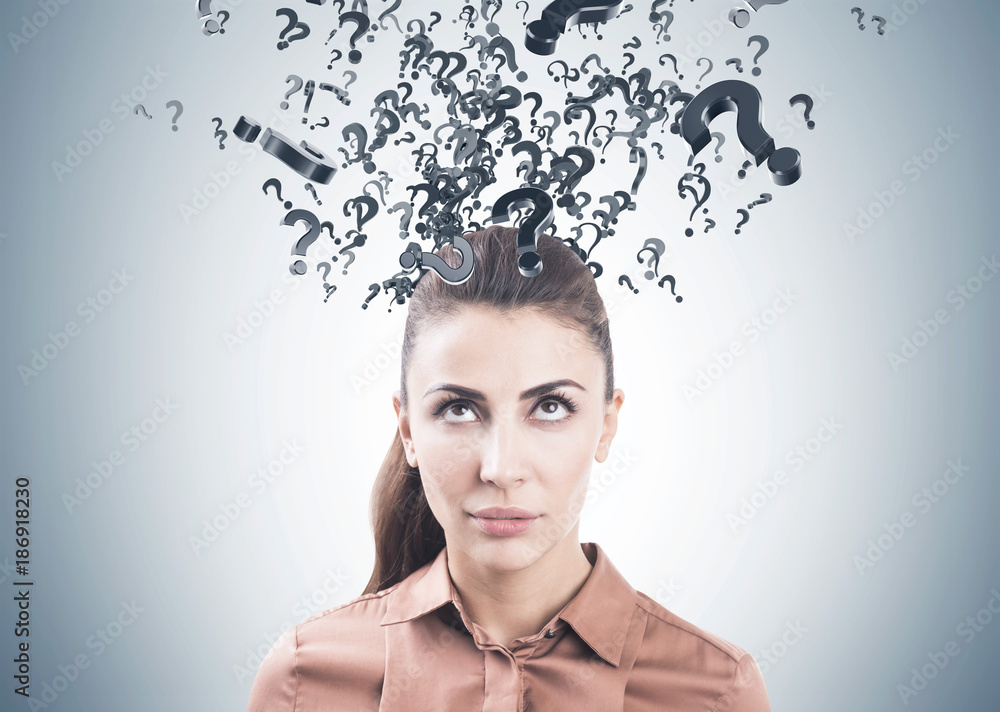 Pensive woman in brown, question marks Pensive woman in brown, question marks
