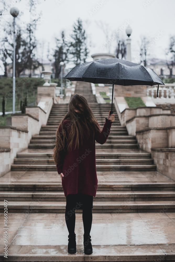 Beautiful girl with black umbrella Stock Photo | Adobe Stock