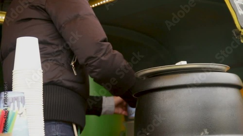 Wallpaper Mural Worker pouring warm soup to feed homeless and poor people, volunteer program Torontodigital.ca