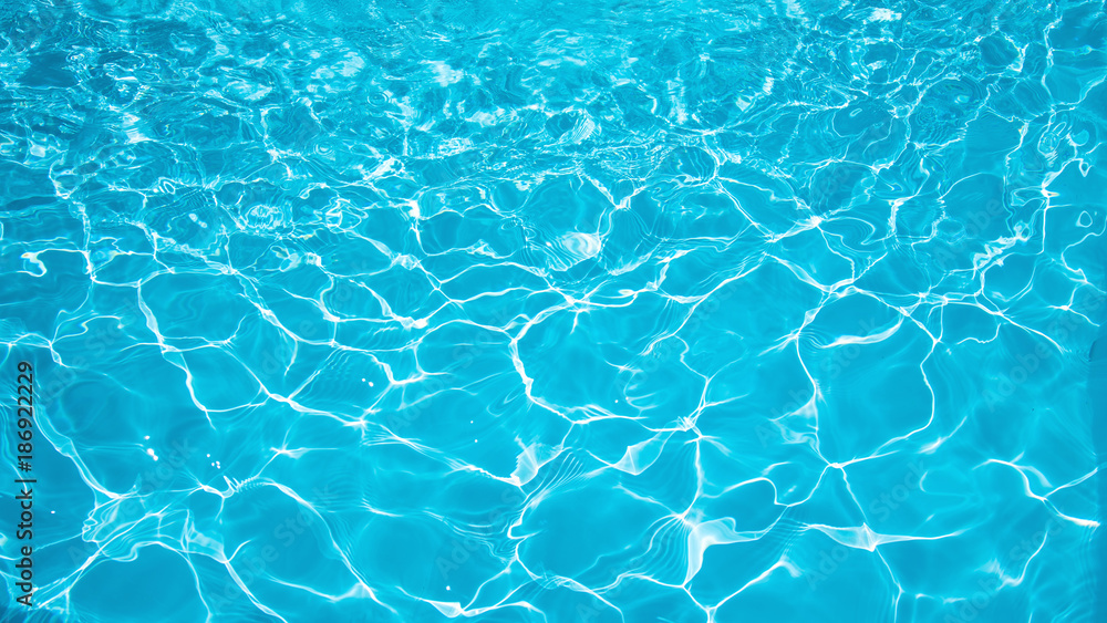 Blue and bright water in swimming pool with sun reflection, Motion of ripple water and gentle wave in pool