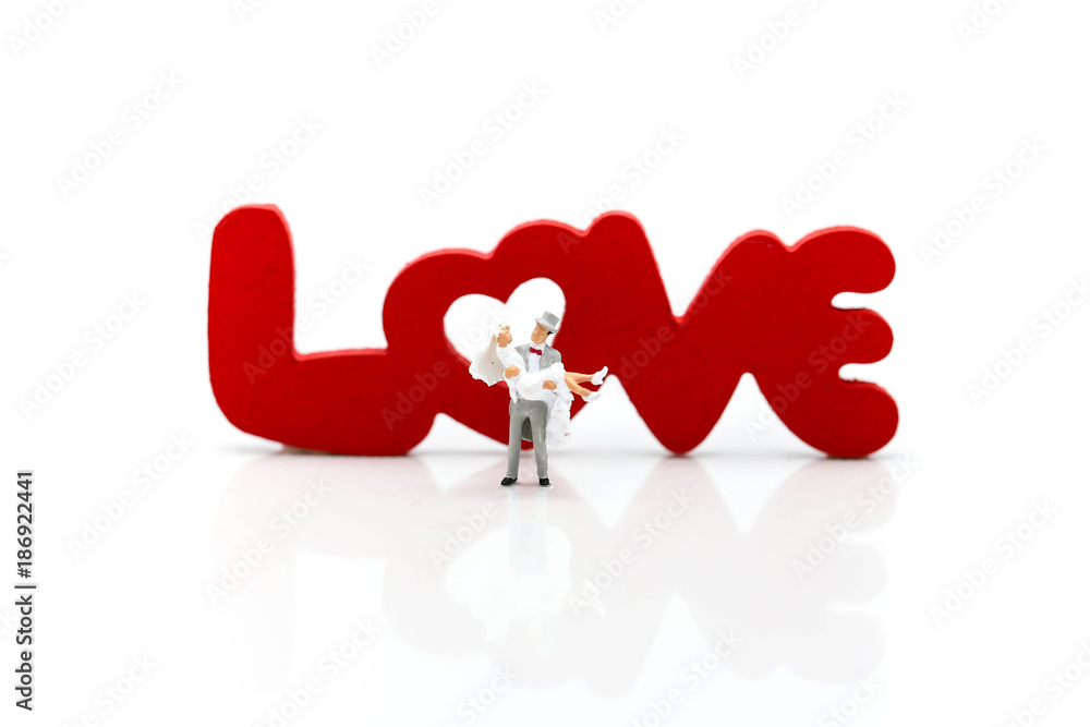 Miniature people: Couple and valentine decorations character with copy space using as background valentine day, Love couple concept Miniature people: Couple and valentine decorations character with copy space using as background valentine day, Love couple concept
