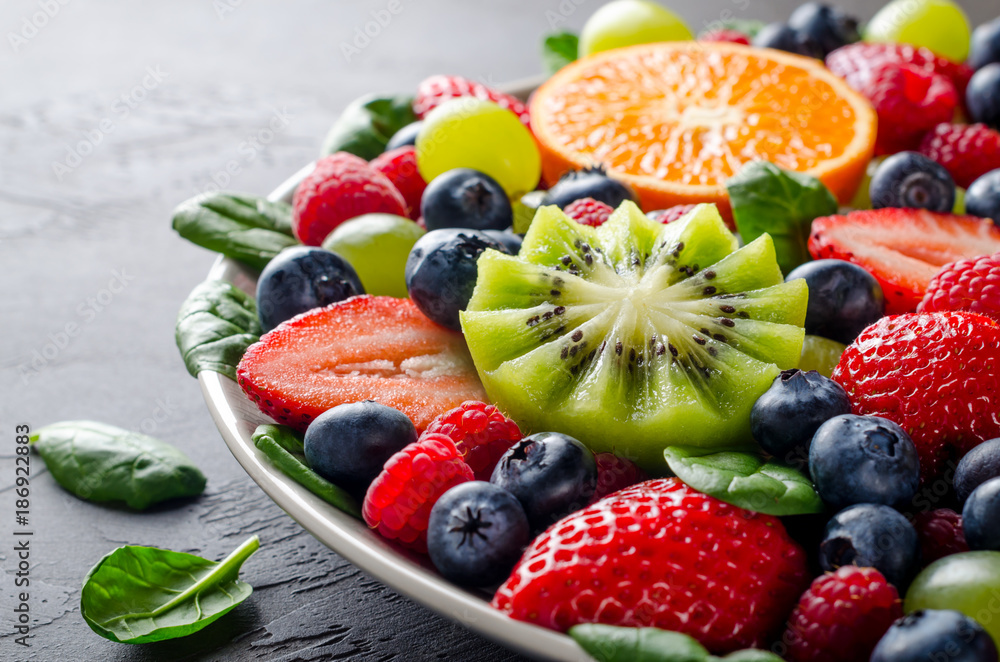 Fruit platter with various fresh strawberry, raspberry, blueberr Fruit platter with various fresh strawberry, raspberry, blueberr