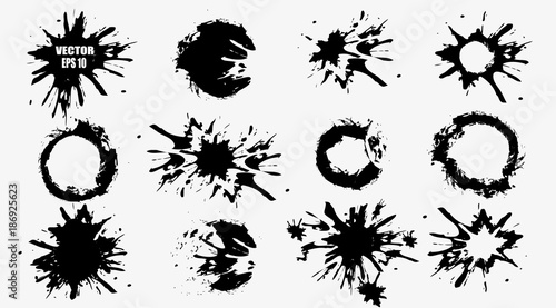Set of black hand-painted blots, on white background and ink splatter. Vector and abstract elements for design in grunge style. 