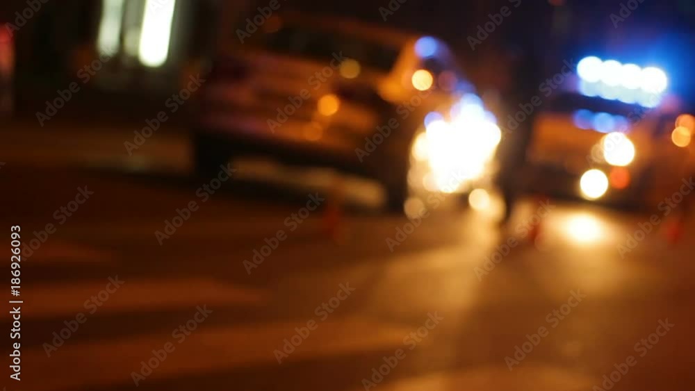 Police car with turned flashlight blocking road to guilty in road accident car Police car with turned flashlight blocking road to guilty in road accident car