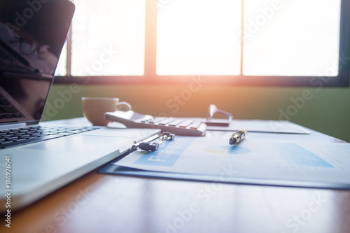 Pen,keyboard,calculator,report graph chart on office table,for Business.