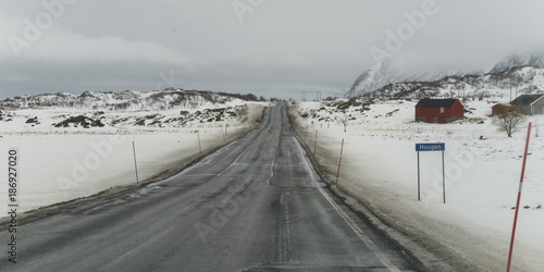 Road passing through snow covered landscape, Lofoten, Nordland, Norway © klevit