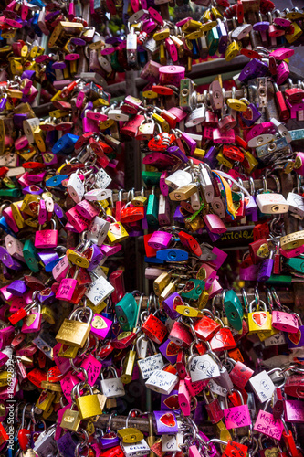 Many colourful love padlocks at the wall of Juliet s house  Verona   Italy
