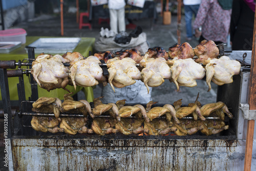 selling grilled/roasted chicken at the fresh market (pasar tani) located in Kelana Jaya,Petaling jaya,selangor,malaysia photo