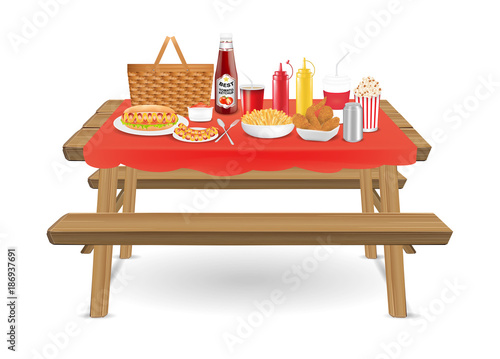picnic wood table with fast food and drink