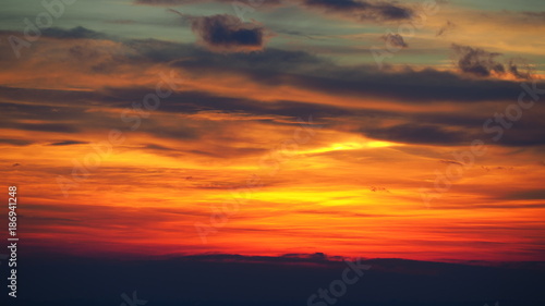Fiery sunset from the old city of Bergamo to the Po valley. Lombardy, Italy