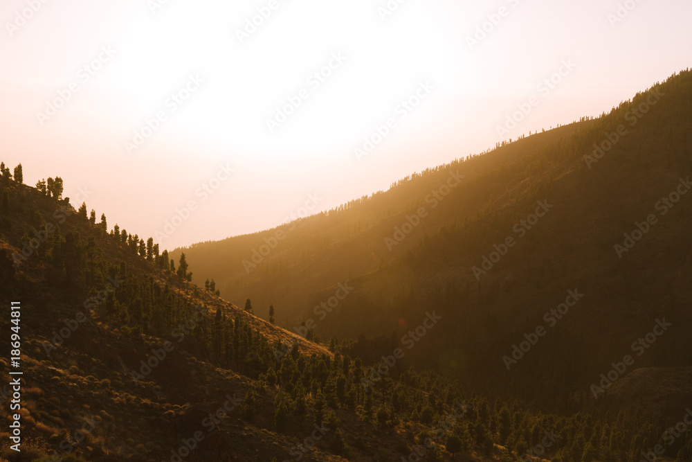 Colorful sunset in valley in mountain landscape