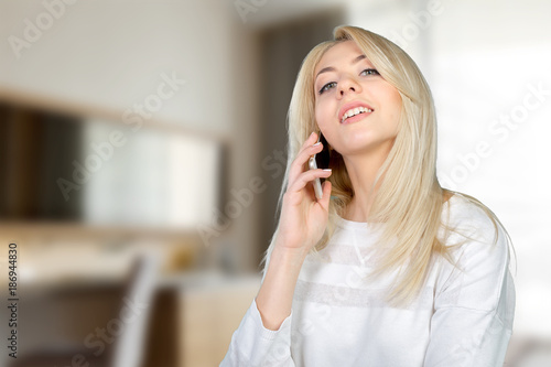 Casual young woman using mobile phone
