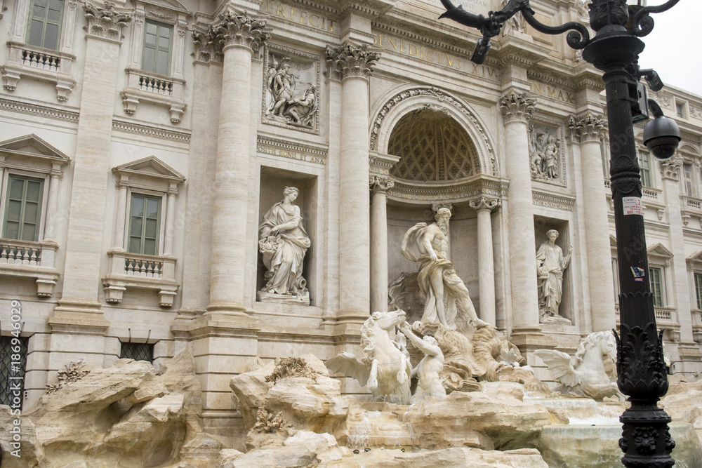 frontal facade of trevi fountain in Rome