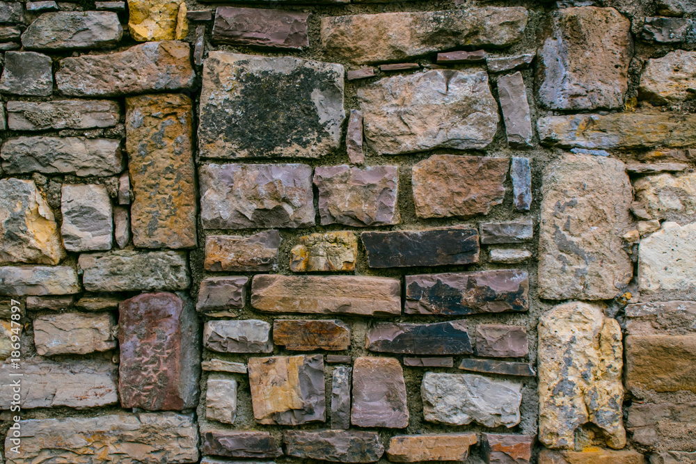 Texture from the pattern obtained from the folded stones in the masonry when building an old stone house. Texture from the pattern obtained from the folded stones in the masonry when building an old stone house.