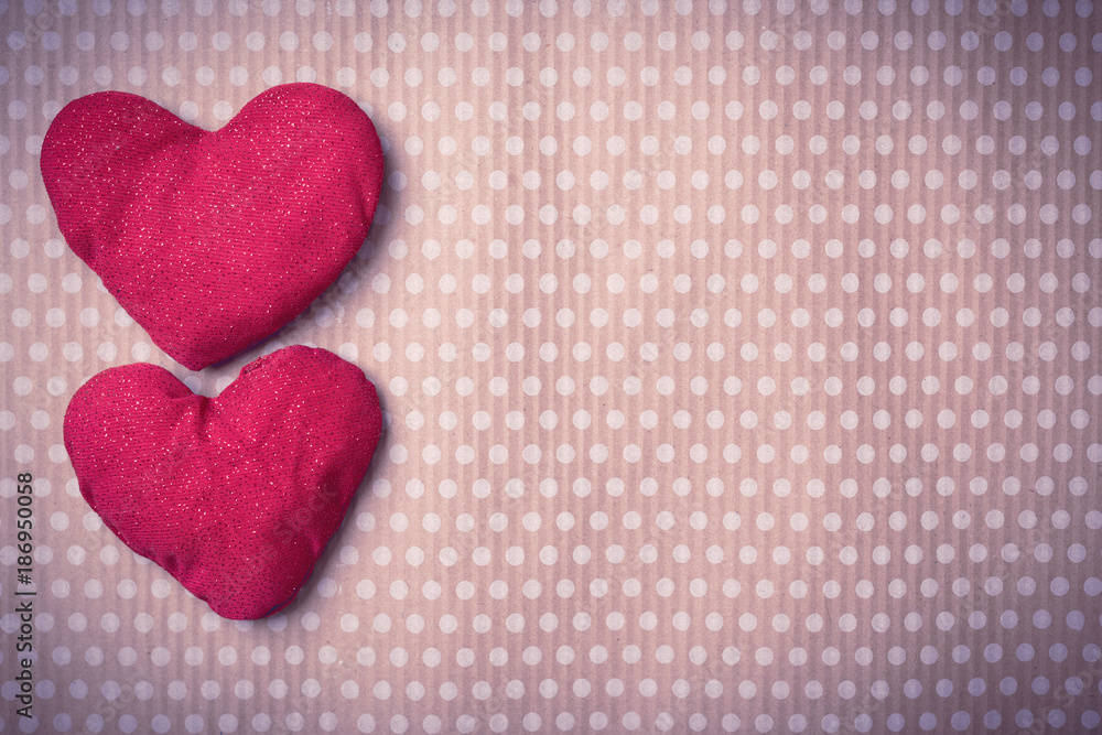 Valentine's Day. Colorful knitted hearts. Valentines day. Heart pendant. Vintage background in peas. Red heart. Handmade Hearts. Valentine cards. Space for text. Toned image.