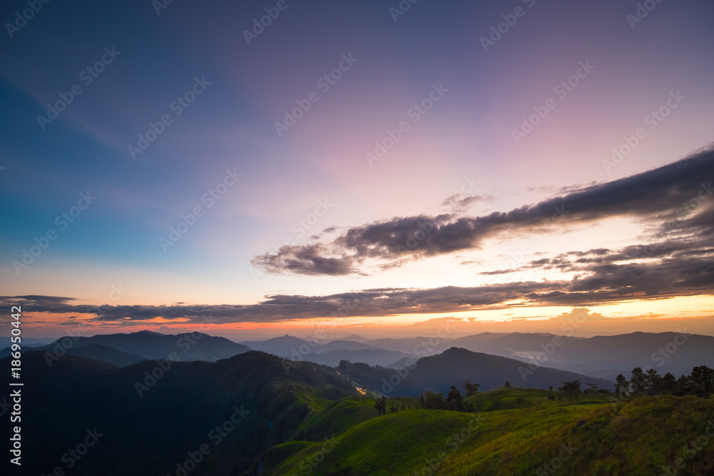 Obraz premium Long explosure shot, Beautiful sunset scene at Phu chi fah Chiangrai Thailand