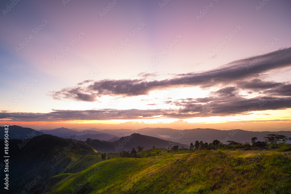 Long explosure shot, Beautiful sunset scene at Phu chi fah Chiangrai Thailand Long explosure shot, Beautiful sunset scene at Phu chi fah Chiangrai Thailand
