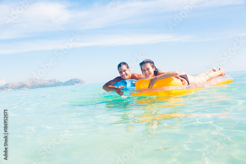 Young Couple With Pool Raft © nullplus