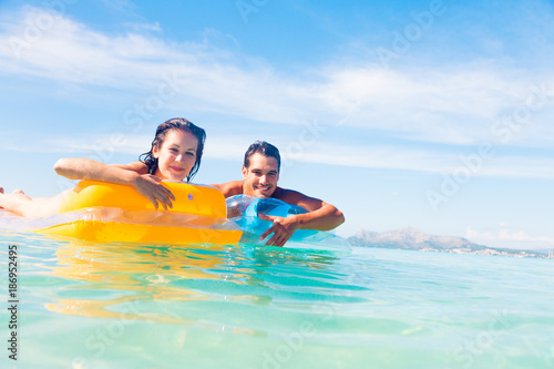 Young Couple With Pool Raft