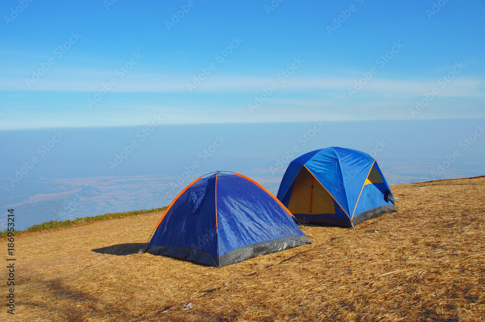 two camping tent on top mountain 