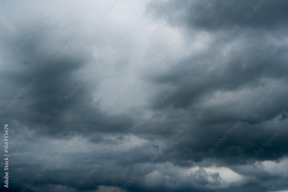 dark storm clouds with background,Dark clouds before a thunder-storm. dark storm clouds with background,Dark clouds before a thunder-storm.