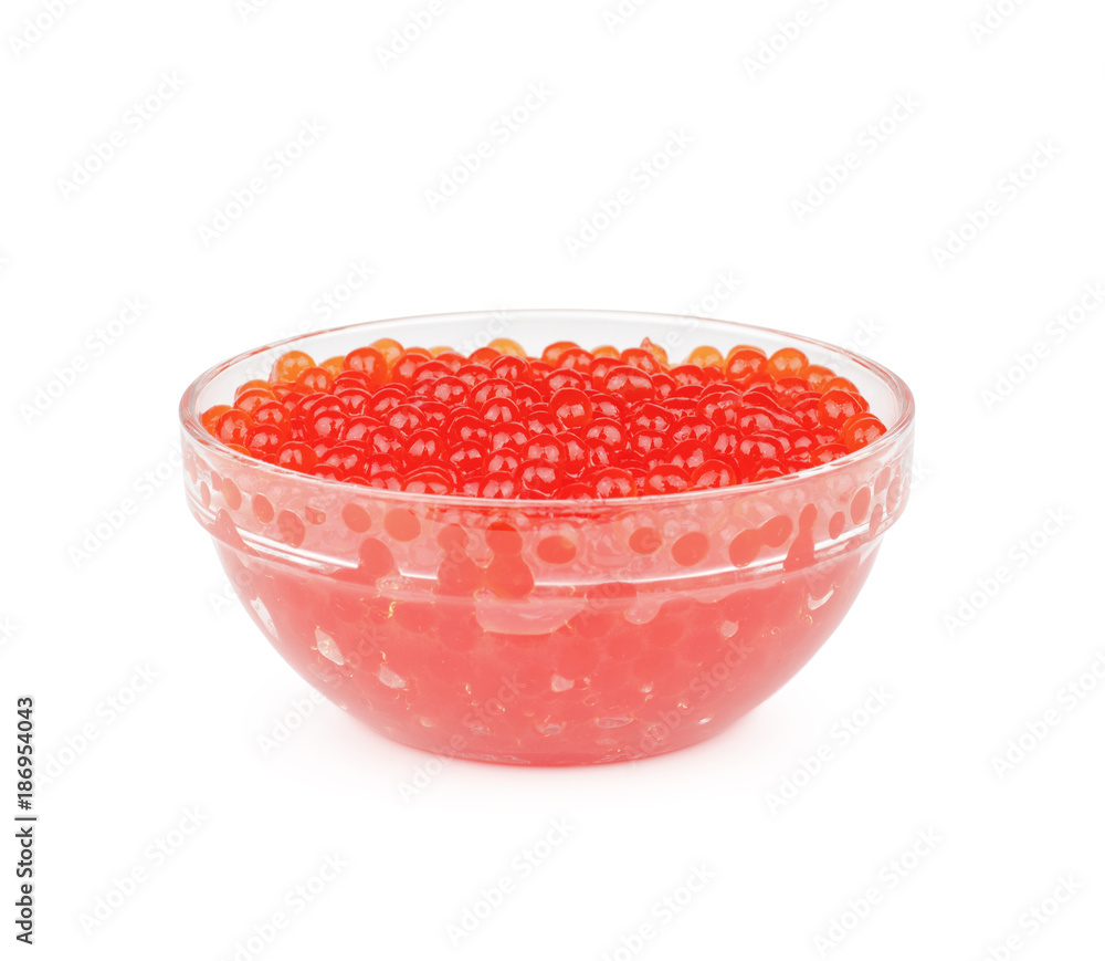 Red caviar in the bowl isolated on white background. Red caviar in the bowl isolated on white background.