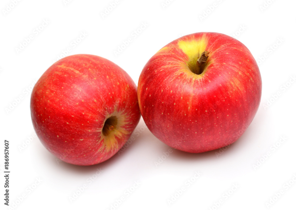 Two beautiful red juicy fruit apples isolated on white background