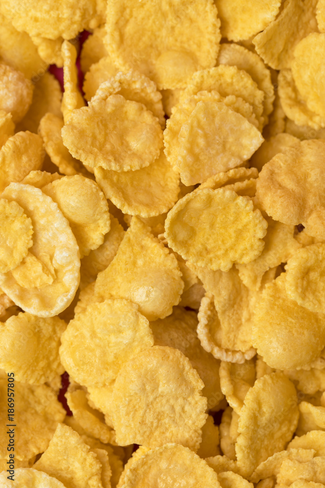 close-up full frame background from healthy crispy corn flakes close-up full frame background from healthy crispy corn flakes
