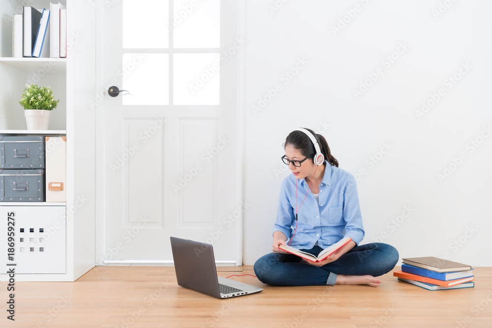 elegant girl wearing earphone sitting on floor elegant girl wearing earphone sitting on floor