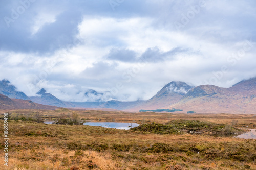 Fototapeta Naklejka Na Ścianę i Meble -  Scenic Landscape View of Mountain, Forest and Lake in Scottish Highlands.