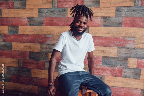 African American man with dreadlocks and a white T-shirt. Mock-up. photo