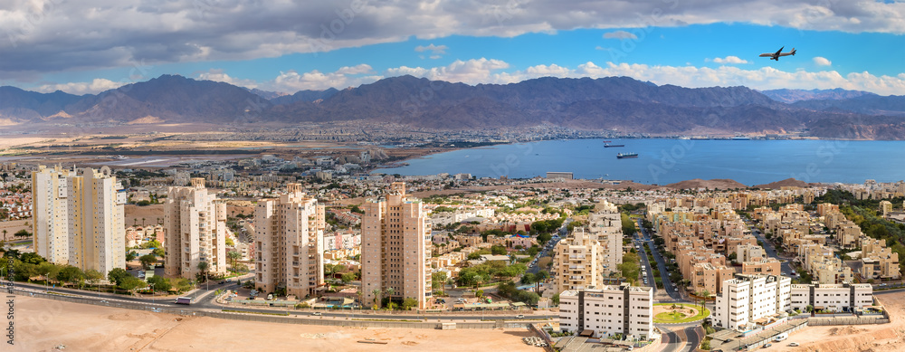 Aerial panoramic view on Eilat (Israel) and Aqaba. The images for panorama were taken from stone hills surrounding Eilat city, Israel 