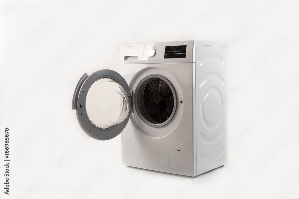 Parents bought a new washing machine. The children try to turn it on and wash the soft toys. Happy boys are playing at home. Parents bought a new washing machine. The children try to turn it on and wash the soft toys. Happy boys are playing at home.