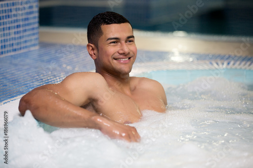 Happy man in pool © Juan Algar