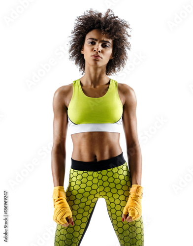 Tired boxer. Photo of young african girl isolated on white background. Strength and motivation