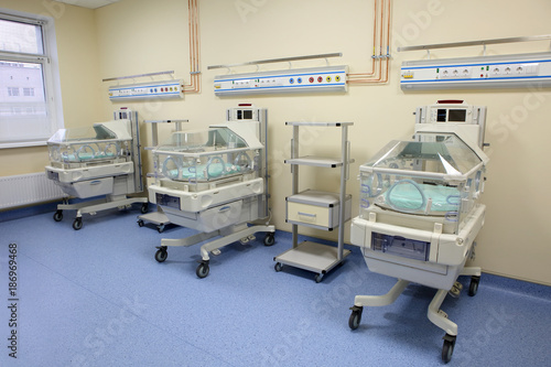 Closeup of infant incubator technology in a medical center hospital  photo