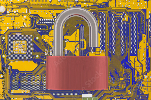 Computer Motherboard With Unlocked Padlock On Light Background. Vulnarable To Attack  Concept. photo