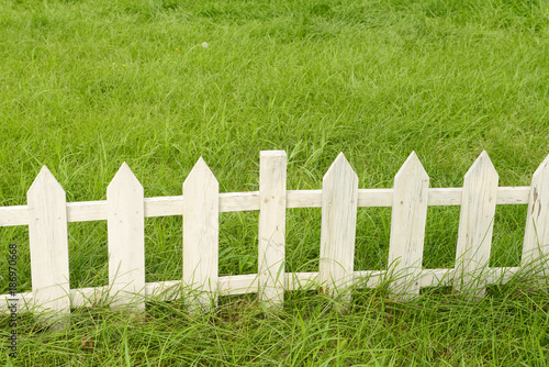 The white wooden fence in the park